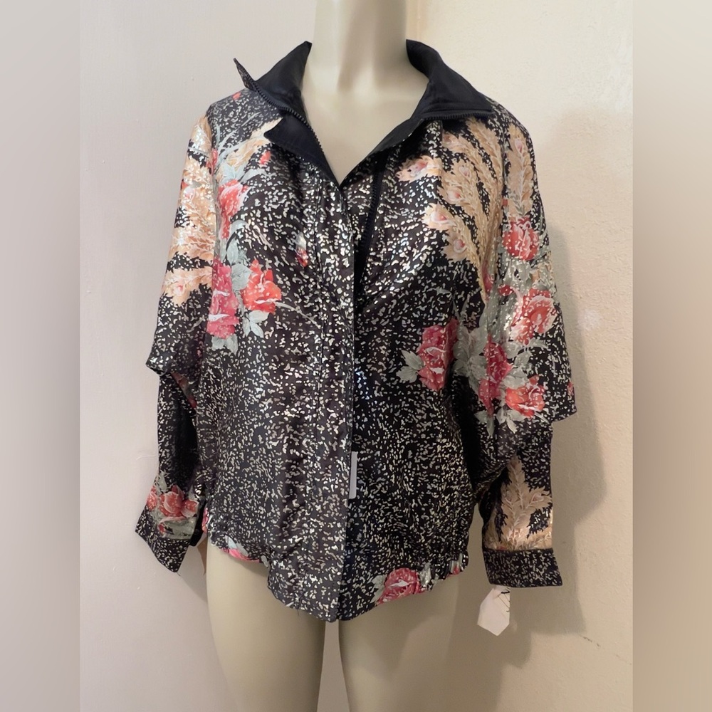 Lightweight, reversible unisex jacket, new with tag.